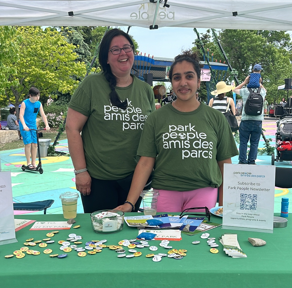 Two women standing in fromt a Park People table