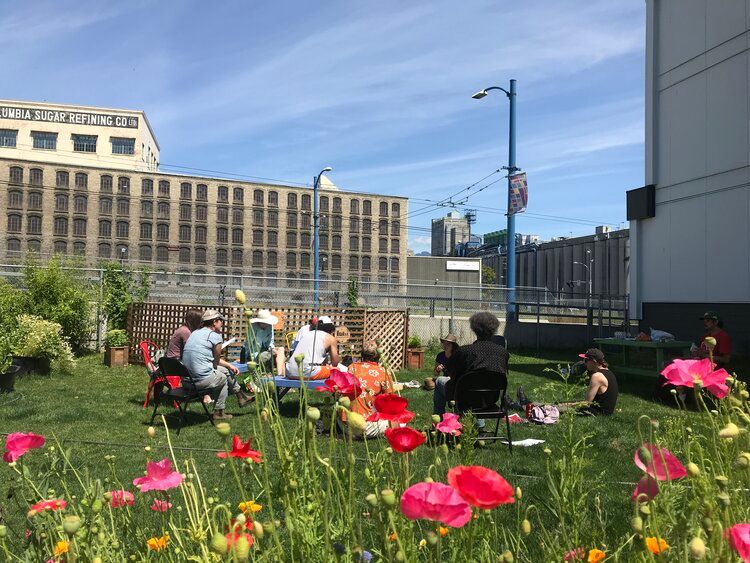 People sitting on a rooftop garden