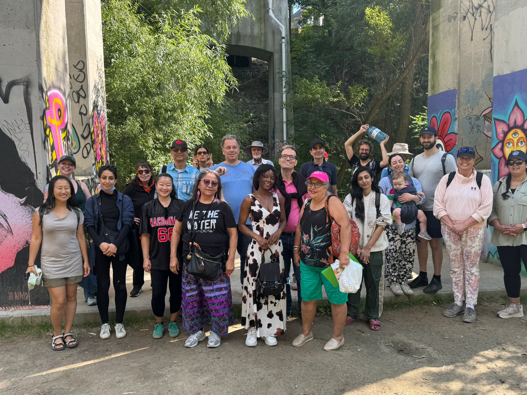 Dozen of people smiling at the camera