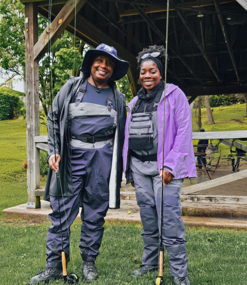 Two black women with a fishing line